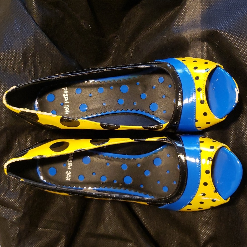 Open toe funky high heeled sandals.